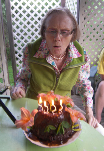 June blowing out the candles on her 80th birthday